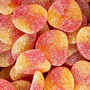 Zachte, gesuikerde snoepschijfjes in warme tinten van rood en oranje, met een perfect evenwicht tussen zoet en zuur. Deze snoepjes smelten op je tong en zijn een verfrissende traktatie op elk moment van de dag.